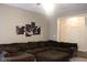 Spacious living room with a large sectional sofa and an open doorway leading to another room at 5607 E 500 N, Greenfield, IN 46140