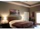 Well-lit main bedroom featuring a comfortable bed and a view of the bathroom at 5607 E 500 N, Greenfield, IN 46140