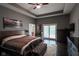 Bedroom featuring hardwood floors, recessed lighting, ensuite, and sliding glass door at 5607 E 500 N, Greenfield, IN 46140