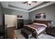 Bedroom featuring hardwood floors, recessed lighting, and ensuite at 5607 E 500 N, Greenfield, IN 46140