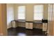 This home office features a built-in desk with lots of drawers, and two windows at 5607 E 500 N, Greenfield, IN 46140