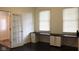 This home office features a built-in desk with lots of drawers, and two windows at 5607 E 500 N, Greenfield, IN 46140