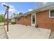 The backyard features a brick home and an expansive concrete patio at 5846 Linton Ln, Indianapolis, IN 46220
