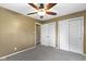 This spacious bedroom features plush gray carpeting, ceiling fan, and ample closet space at 5846 Linton Ln, Indianapolis, IN 46220