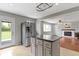 Bright kitchen with stainless steel refrigerator, island, and easy access to the backyard at 5846 Linton Ln, Indianapolis, IN 46220