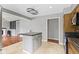 Kitchen featuring a center island, stainless steel appliances, and easy access to living room at 5846 Linton Ln, Indianapolis, IN 46220