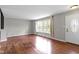 Spacious living room featuring hardwood floors, large windows, and great natural light at 5846 Linton Ln, Indianapolis, IN 46220