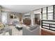 Staged living area featuring hardwood floors, modern decor, and a comfortable seating arrangement at 5846 Linton Ln, Indianapolis, IN 46220