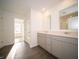 Bathroom featuring dual sinks, modern cabinets, and stylish flooring at 6216 Cascades Dr, Whitestown, IN 46075