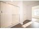 Bright bathroom featuring a large glass enclosed shower and wood-look flooring at 6216 Cascades Dr, Whitestown, IN 46075