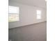 Well-lit bedroom featuring large windows and plush carpeting at 6216 Cascades Dr, Whitestown, IN 46075