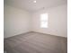Bedroom with neutral carpet, white walls and a bright window with a backyard view at 6216 Cascades Dr, Whitestown, IN 46075