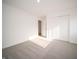 Bedroom with neutral carpet featuring a double door closet and opening to another room at 6216 Cascades Dr, Whitestown, IN 46075