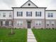 Charming townhouse with manicured lawn and inviting entryway, perfect for modern living at 6216 Cascades Dr, Whitestown, IN 46075