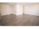 Open-concept living area with modern flooring and abundant natural light at 6216 Cascades Dr, Whitestown, IN 46075
