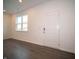 Bright living room featuring a window and sleek, modern flooring at 6216 Cascades Dr, Whitestown, IN 46075