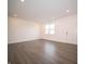 Inviting living room showcasing modern flooring and ample space for furnishings at 6216 Cascades Dr, Whitestown, IN 46075