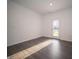 Bright and spacious living room with a door leading to the backyard at 6216 Cascades Dr, Whitestown, IN 46075