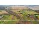 Aerial view of a farm with multiple houses and a pool at 647 N 100 W, Franklin, IN 46131