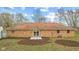 A brick house has a backyard with a freshly mulched garden at 647 N 100 W, Franklin, IN 46131
