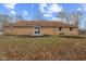 A brick house has a large yard with a mulched garden at 647 N 100 W, Franklin, IN 46131