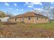 Backyard view of brick home with sliding doors and storage shed at 647 N 100 W, Franklin, IN 46131