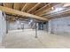 Unfinished basement with concrete floors and an exposed wooden ceiling at 647 N 100 W, Franklin, IN 46131