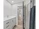 Modern bathroom with sleek white vanity, contemporary fixtures, and stylish shower curtain at 647 N 100 W, Franklin, IN 46131