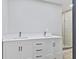 A bright bathroom features a double sink vanity and a glass shower at 647 N 100 W, Franklin, IN 46131