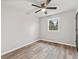 Bright bedroom featuring modern flooring, neutral paint, and a window with outdoor views at 647 N 100 W, Franklin, IN 46131