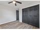 This bedroom features modern wood-look flooring and a stylish ceiling fan fixture at 647 N 100 W, Franklin, IN 46131