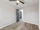 A cozy bedroom features a ceiling fan, modern flooring, and neutral paint for a calming ambiance at 647 N 100 W, Franklin, IN 46131