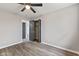 A well-lit bedroom features a ceiling fan, modern flooring, and an open closet at 647 N 100 W, Franklin, IN 46131