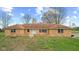 Charming brick home featuring a cozy front porch and well-maintained lawn at 647 N 100 W, Franklin, IN 46131