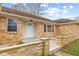 Close-up of the front porch with stylish brick columns, leading to a welcoming white front door at 647 N 100 W, Franklin, IN 46131
