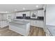 Modern kitchen with a central island, granite countertops, and bright white cabinets for a sleek look at 647 N 100 W, Franklin, IN 46131