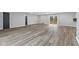 Open-concept living area featuring luxury vinyl plank floors and neutral decor at 647 N 100 W, Franklin, IN 46131