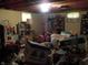 Basement storage room with personal items, lamp, and shelves at 6736 E Michigan St, Indianapolis, IN 46219