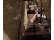 Basement stairs lead down into storage area filled with personal belongings at 6736 E Michigan St, Indianapolis, IN 46219