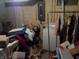 Basement laundry area with washer, clothing rack, and storage at 6736 E Michigan St, Indianapolis, IN 46219