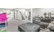 A finished basement includes a seating area, stairs, and storage creating a versatile living space at 6758 Woodcliff Cir, Zionsville, IN 46077