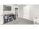 Basement space with wall-mounted TV and storage shelves, perfect for entertainment or organization at 6758 Woodcliff Cir, Zionsville, IN 46077