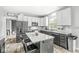 Bright kitchen features an island, stainless steel appliances, and stylish backsplash at 6758 Woodcliff Cir, Zionsville, IN 46077