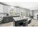 Bright kitchen featuring a center island with bar stool seating and modern appliances at 6758 Woodcliff Cir, Zionsville, IN 46077