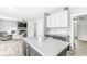 Open kitchen featuring a center island and seamless flow into the inviting living area at 6758 Woodcliff Cir, Zionsville, IN 46077