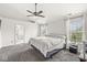 This main bedroom boasts vaulted ceilings, large windows, and an ensuite bathroom at 6758 Woodcliff Cir, Zionsville, IN 46077