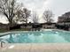 Inviting in-ground pool surrounded by lush landscaping, a gazebo, and ample space for relaxation at 6811 S Meridian St, Indianapolis, IN 46217
