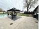 Resort-style backyard with in-ground pool, cabana, and lounge seating, perfect for entertaining at 6811 S Meridian St, Indianapolis, IN 46217