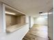 Finished basement with a bar area, new flooring, and neutral paint at 6811 S Meridian St, Indianapolis, IN 46217