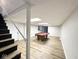 Finished basement featuring a pool table, new flooring, and ample space at 6811 S Meridian St, Indianapolis, IN 46217